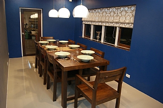 Dining room with locally made teak furniture.