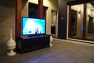 Main living area with 3D television and PS3.